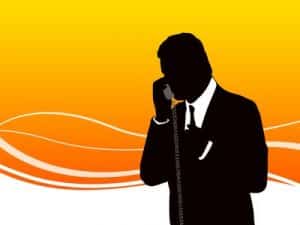 Silhouette of business man speaking on the phone