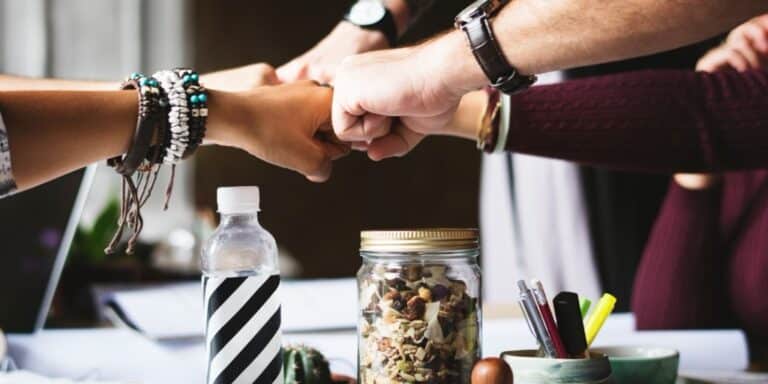 Colleagues fist bumping in a meeting