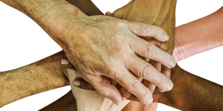 Hands on top of one another in a huddle to signify a partnership