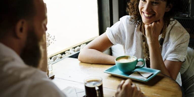 Two work colleagues meeting over a cup of coffee