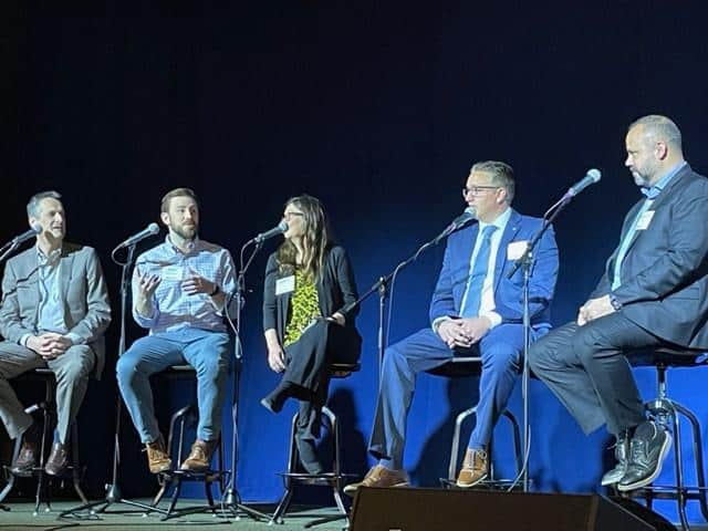 Panel discussion of speakers at the event, AI in DE.