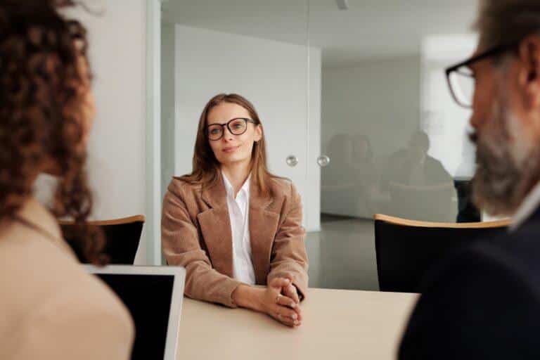 Woman displaying proper posture and positive body language during a job interview