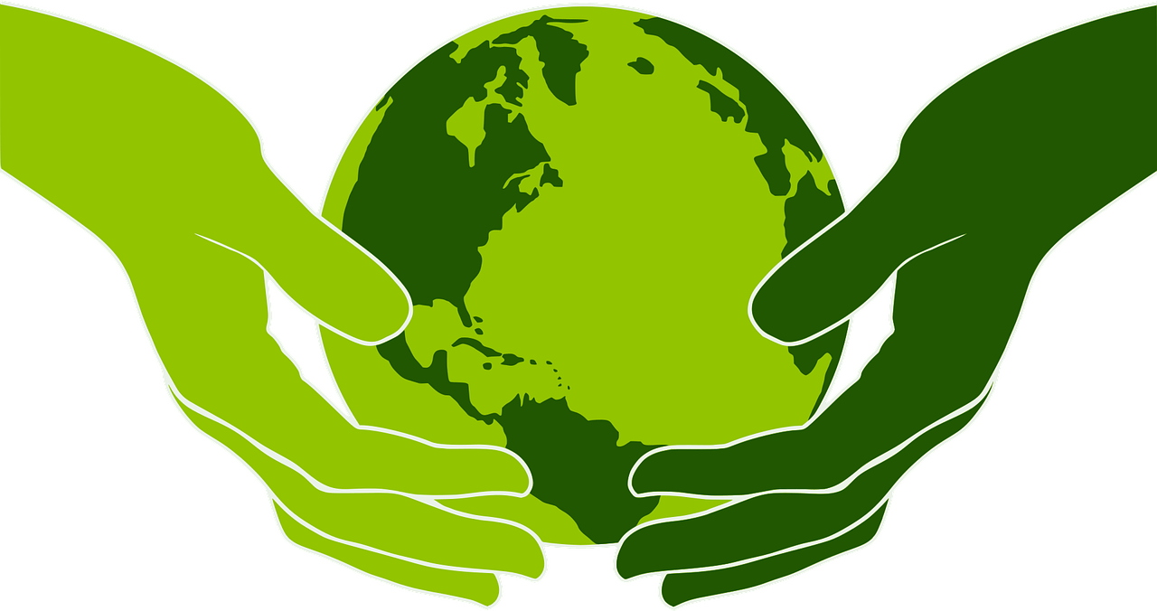 Green hands holding a green Earth